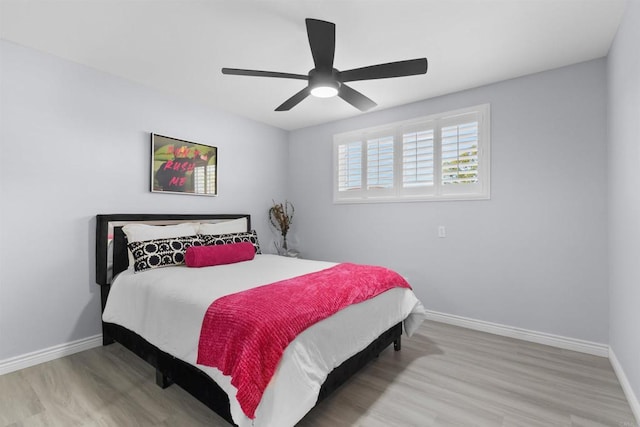 7162 Beagle St, San Diego, CA 92111 - bedroom with wood finished floors, baseboards, and a ceiling fan