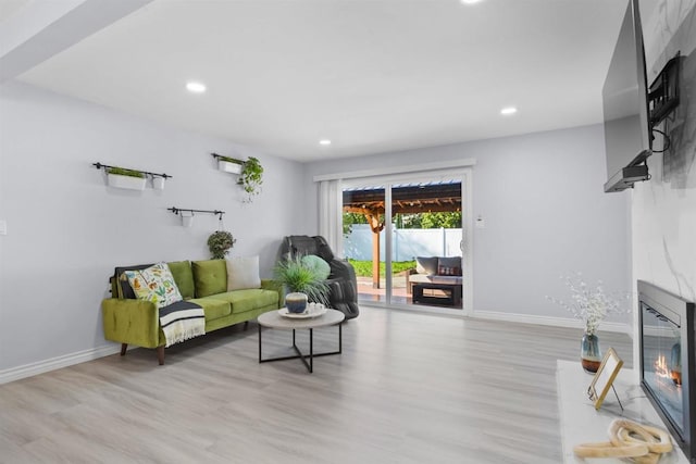 7162 Beagle St, San Diego, CA 92111 - living room featuring wood finished floors, a fireplace, recessed lighting, and baseboards