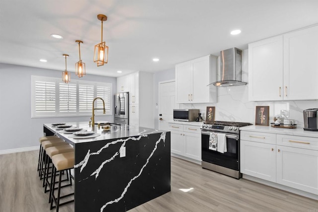 7162 Beagle St, San Diego, CA 92111 - kitchen with stainless steel appliances, wall chimney exhaust hood, a sink, a kitchen breakfast bar, and a kitchen island with sink