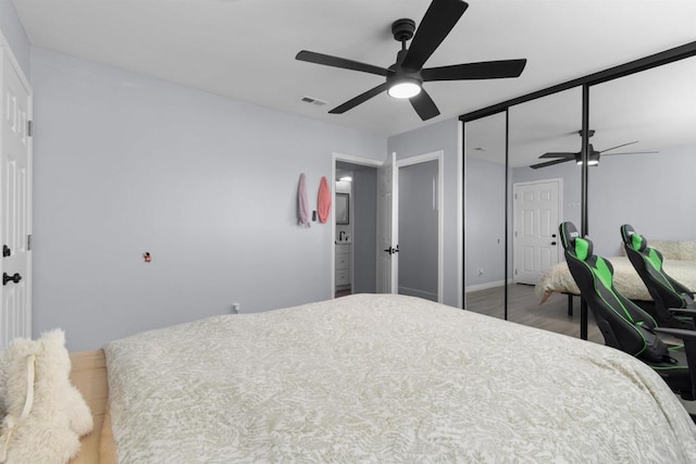 7162 Beagle St, San Diego, CA 92111 - bedroom featuring wood finished floors, ceiling fan, and a closet
