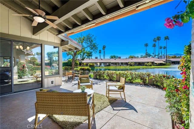 view of patio / terrace with a water view and ceiling fan