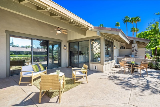 view of patio / terrace featuring a ceiling fan, area for grilling, exterior kitchen, an outdoor hangout area, and outdoor dining area