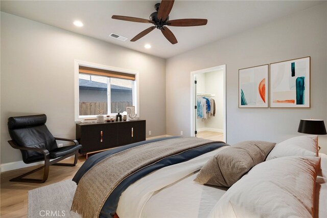 766 Willow St, Paradise, CA 95969 - bedroom featuring wood finished floors, baseboards, recessed lighting, ceiling fan, and a walk in closet