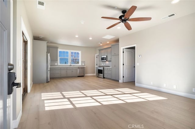 766 Willow St, Paradise, CA 95969 - unfurnished living room with light wood-style floors, a ceiling fan, and recessed lighting