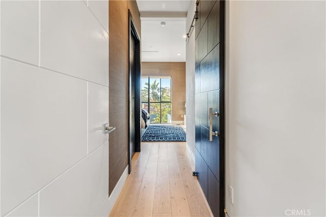 hallway with light wood-style floors