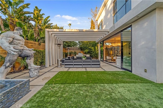 view of yard with an outdoor hangout area, a pergola, fence, and a patio area