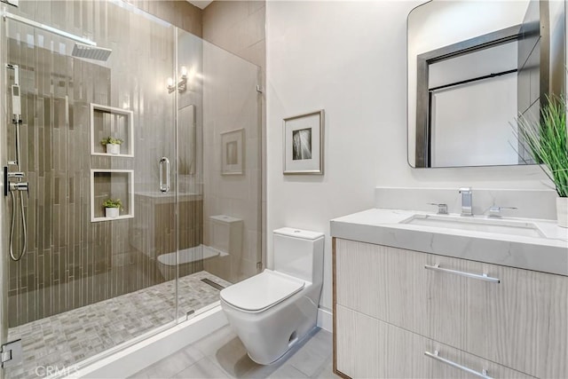 full bath featuring vanity, toilet, tile patterned flooring, and a shower stall