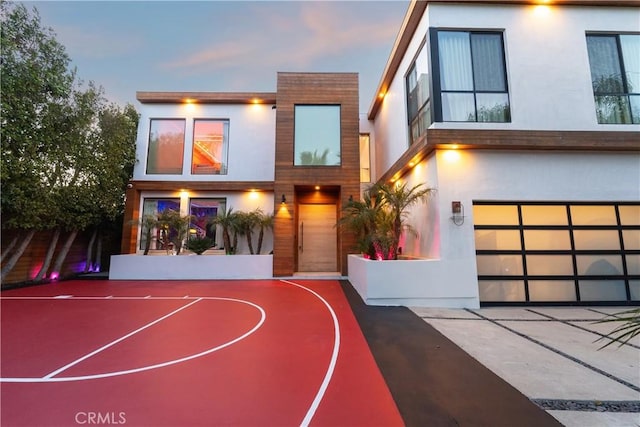 view of sport court featuring basketball hoop