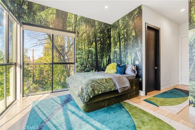 bedroom featuring wallpapered walls, baseboards, and recessed lighting