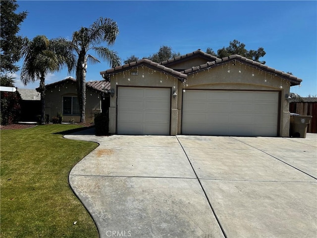 ranch-style home with a front yard, a garage, a tiled roof, concrete driveway, and stucco siding