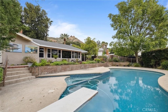 4254 Miramonte Pl, Riverside, CA 92501 - view of pool with a fenced backyard, a diving board, and a pool with connected hot tub