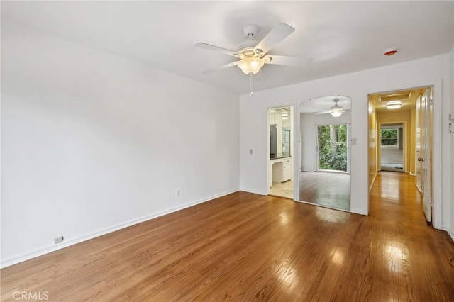 4254 Miramonte Pl, Riverside, CA 92501 - unfurnished bedroom featuring wood finished floors, baseboards, a ceiling fan, and connected bathroom