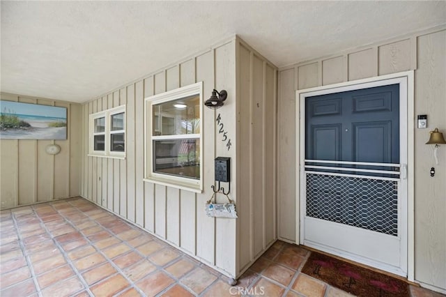 4254 Miramonte Pl, Riverside, CA 92501 - view of exterior entry featuring board and batten siding and a porch