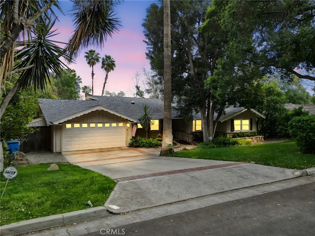 4254 Miramonte Pl, Riverside, CA 92501 - ranch-style house with a garage, a yard, concrete driveway, and roof with shingles