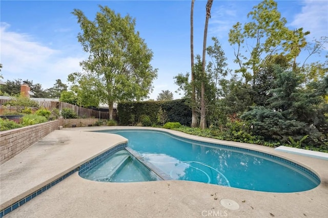4254 Miramonte Pl, Riverside, CA 92501 - view of pool with a fenced backyard, a pool with connected hot tub, and a patio area