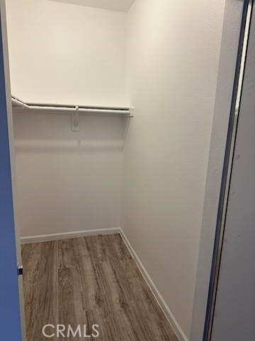 375 Central Ave Unit 12, Riverside, CA 92507 - walk in closet featuring wood finished floors