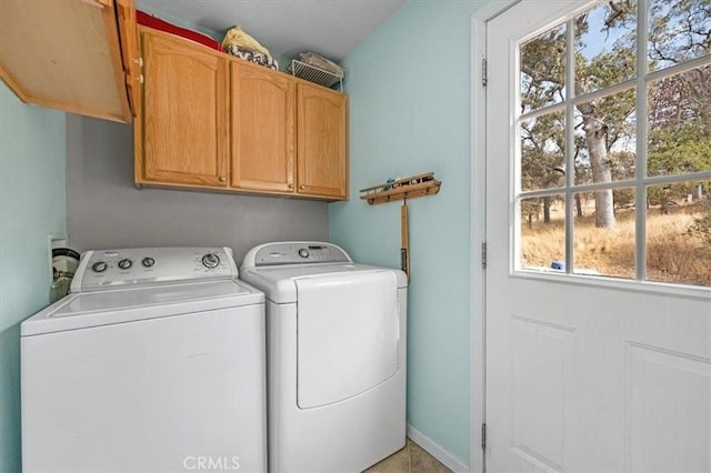laundry room featuring cabinet space and washer and dryer