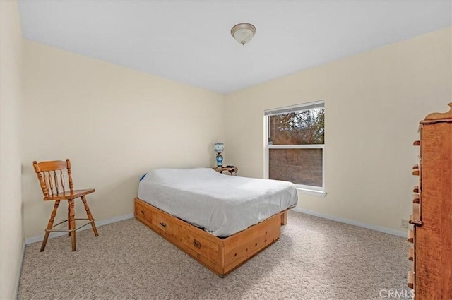 carpeted bedroom with baseboards