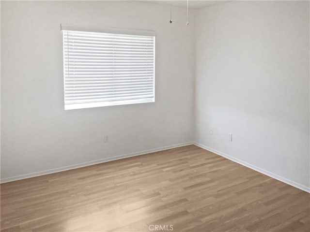 15605 Lasselle St Unit 6, Moreno Valley, CA 92551 - empty room featuring light wood-style floors and baseboards