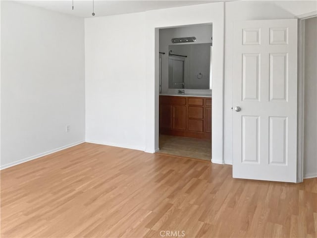 15605 Lasselle St Unit 6, Moreno Valley, CA 92551 - unfurnished room with light wood finished floors, baseboards, and a sink