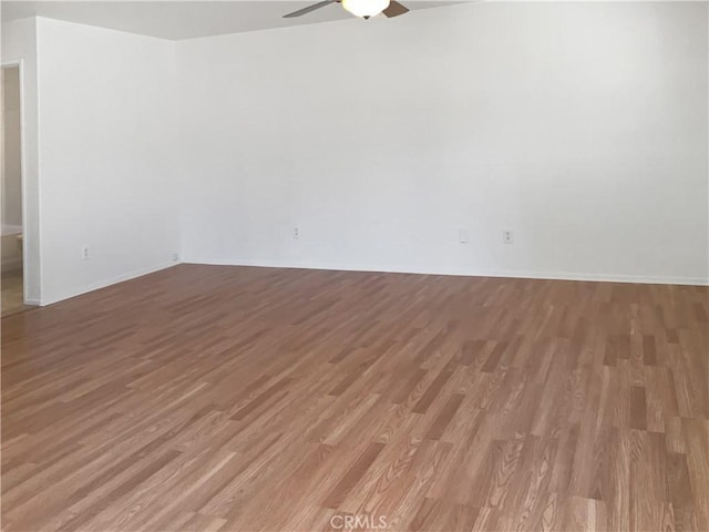 15605 Lasselle St Unit 6, Moreno Valley, CA 92551 - empty room with light wood-style floors, ceiling fan, and baseboards