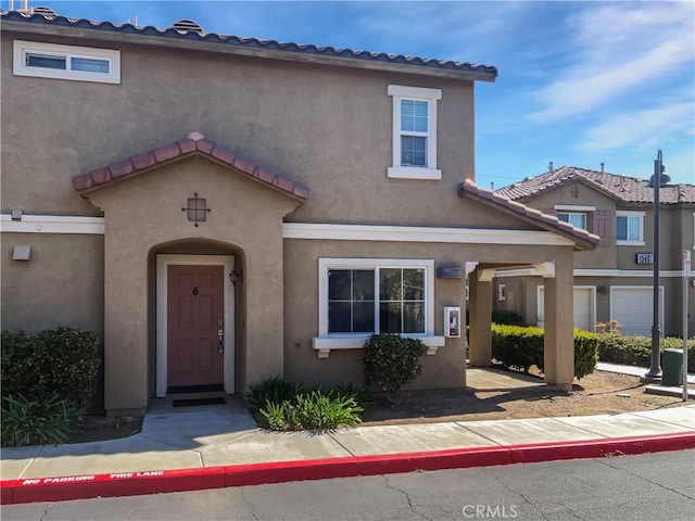 15605 Lasselle St Unit 6, Moreno Valley, CA 92551 - view of front of property featuring stucco siding and a tiled roof