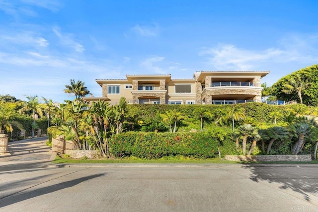 5023 Windsor Dr, San Diego, CA 92109 - view of front facade featuring stone siding, a tile roof, and stucco siding