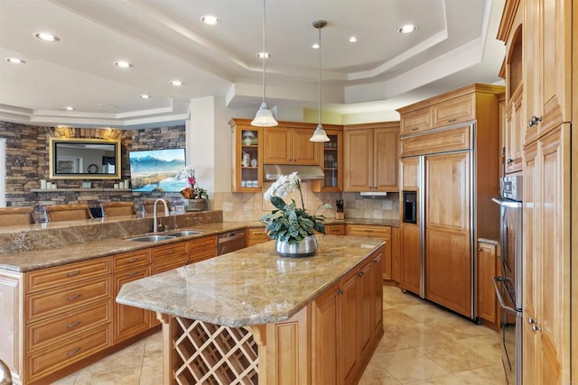 5023 Windsor Dr, San Diego, CA 92109 - kitchen with a raised ceiling, a sink, paneled fridge, tasteful backsplash, and a center island