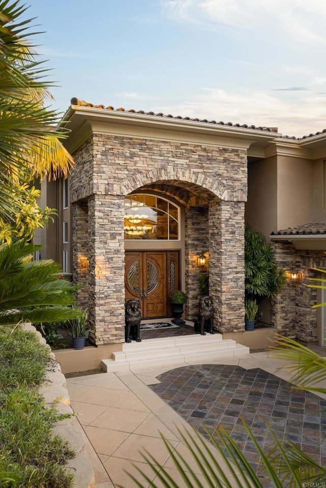 5023 Windsor Dr, San Diego, CA 92109 - entrance to property featuring stucco siding, stone siding, and a tile roof