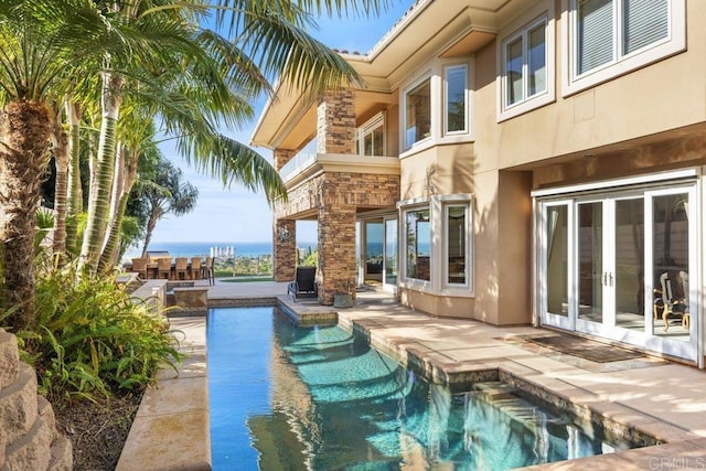 5023 Windsor Dr, San Diego, CA 92109 - outdoor pool with french doors and a patio