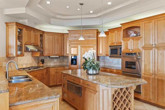 5023 Windsor Dr, San Diego, CA 92109 - kitchen with a warming drawer, built in appliances, under cabinet range hood, a center island, and light stone countertops