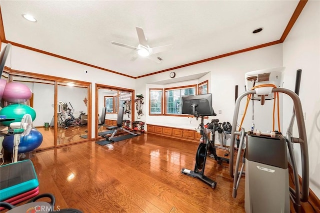 41504 Mission Dr, Palmdale, CA 93551 - workout area featuring hardwood / wood-style flooring, a ceiling fan, and crown molding