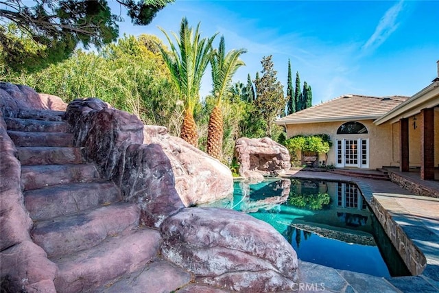 41504 Mission Dr, Palmdale, CA 93551 - outdoor pool featuring french doors and a patio area