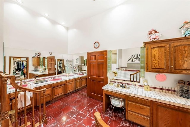 41504 Mission Dr, Palmdale, CA 93551 - bathroom with high vaulted ceiling and tile patterned floors