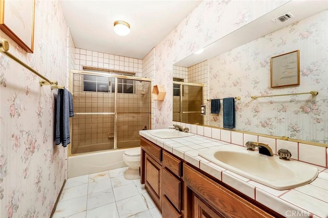 41504 Mission Dr, Palmdale, CA 93551 - full bath featuring double vanity, shower / bath combination with glass door, and marble finish floors