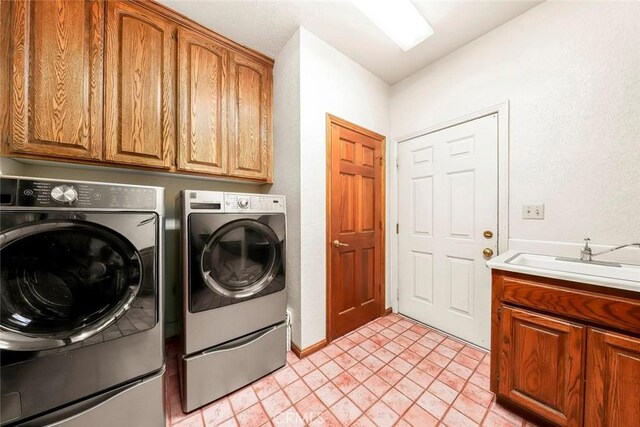 41504 Mission Dr, Palmdale, CA 93551 - laundry room with washer and clothes dryer and cabinet space
