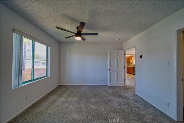 201 Calle Miramar Unit 16, Redondo Beach, CA 90277 - unfurnished room with a ceiling fan, carpet, a textured ceiling, and baseboards