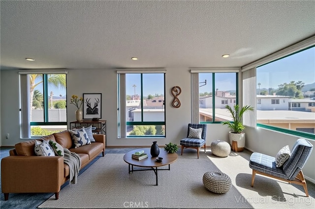 201 Calle Miramar Unit 16, Redondo Beach, CA 90277 - living room featuring a textured ceiling and recessed lighting