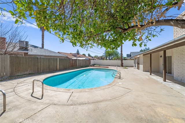 view of swimming pool featuring a patio area, a fenced backyard, and a fenced in pool