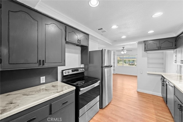 kitchen with visible vents, light wood-type flooring, crown molding, a textured ceiling, and appliances with stainless steel finishes