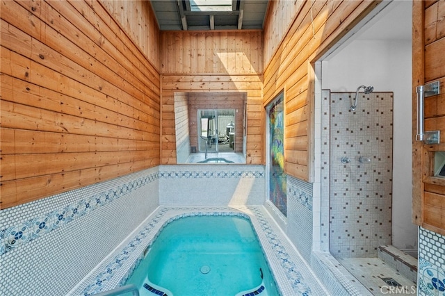 view of pool with an indoor in ground hot tub