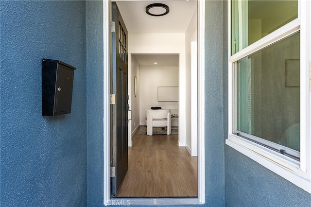 property entrance featuring stucco siding