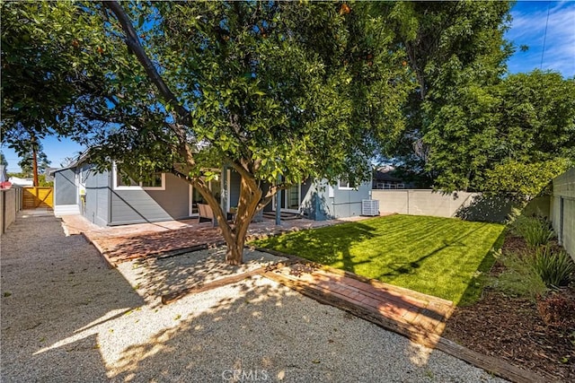 view of yard featuring a fenced backyard and a patio