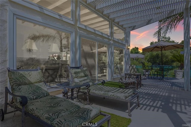 view of patio / terrace featuring a pergola and outdoor dining space