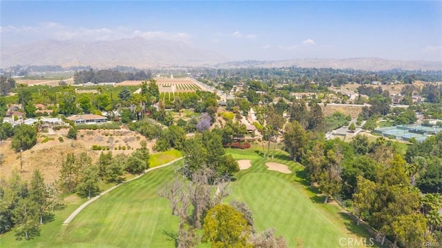 birds eye view of property featuring golf course view and a mountain view