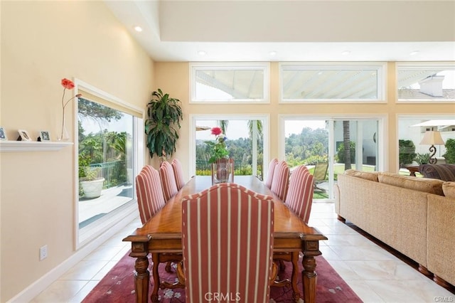 dining area with light tile patterned floors