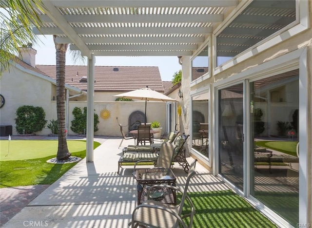 view of patio featuring a pergola, outdoor dining area, and fence