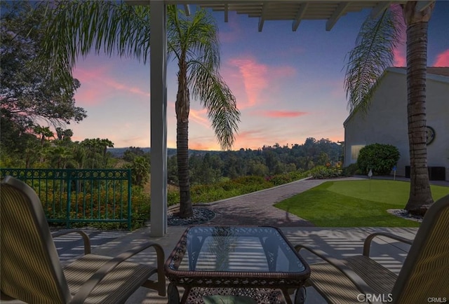 view of patio terrace at dusk
