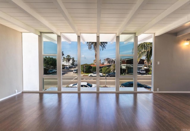 1801 Coast Blvd, Del Mar, CA 92014 - empty room featuring expansive windows, beamed ceiling, baseboards, and wood finished floors