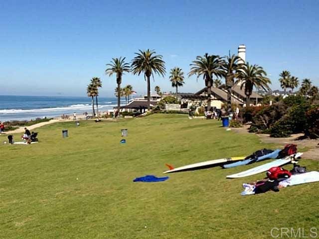 1801 Coast Blvd, Del Mar, CA 92014 - view of home's community with a water view and a lawn